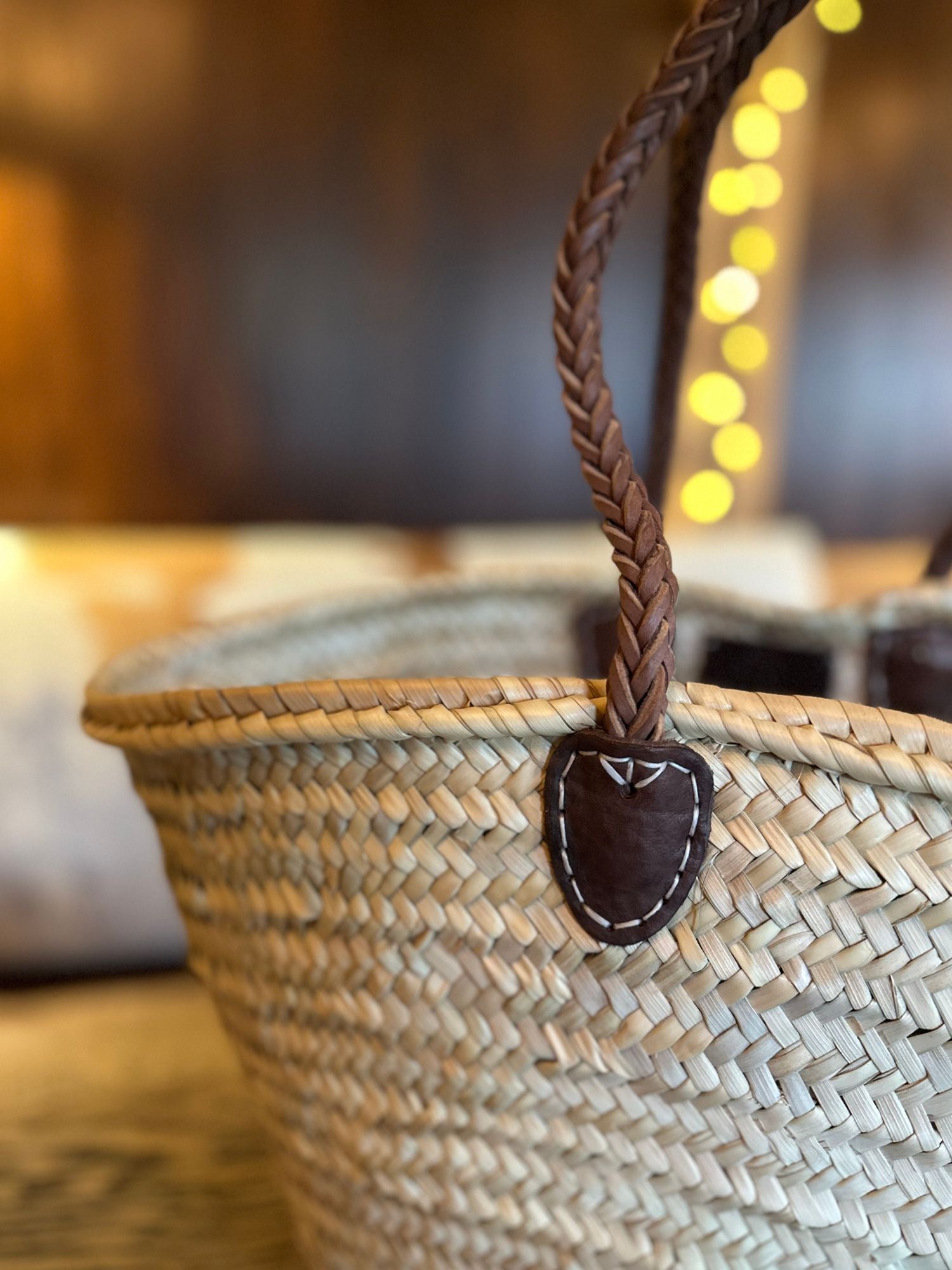 handwoven raffia basket bag with braided handles